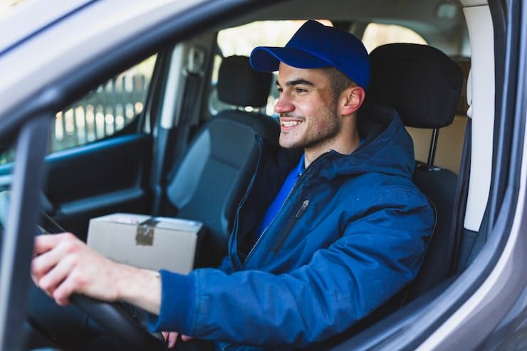 Smiling Horizon Logistics driver in branded uniform behind the wheel